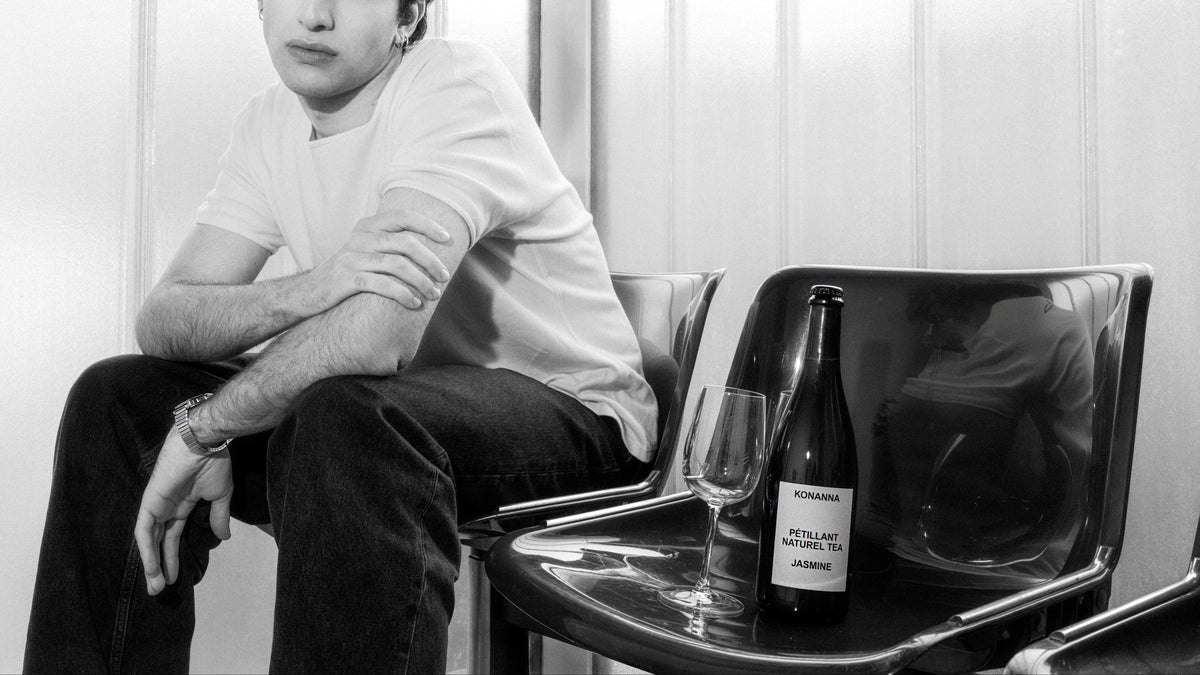 KONANNA Jasmine beside a wine glass